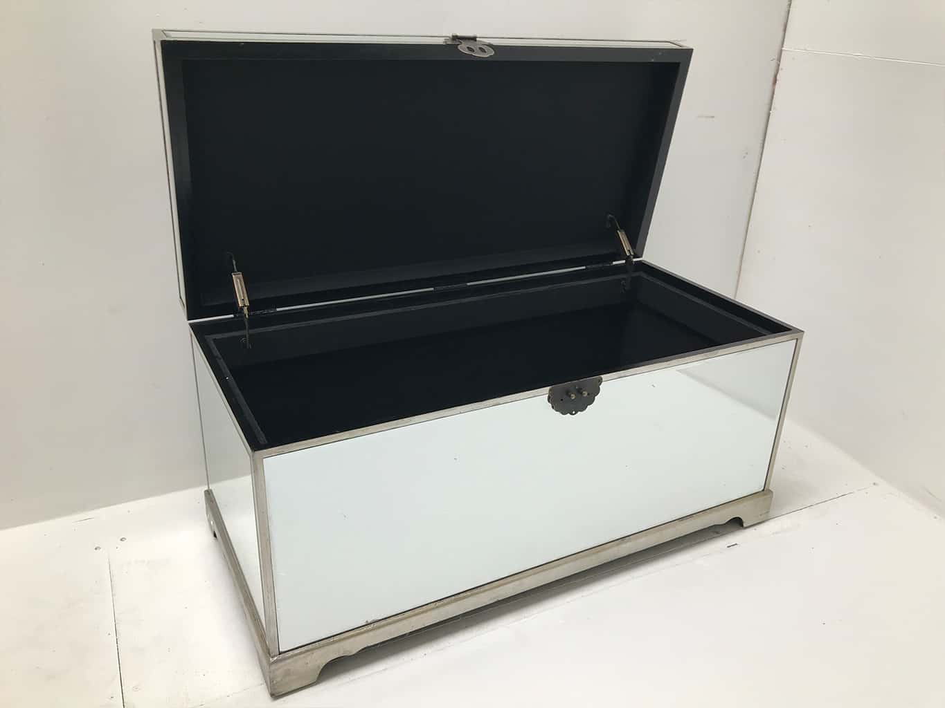 Hollywood Mirrored Trunk with all bevelled mirror panels, the lift up lid is upholstered in a silver crushed velvet material, so can be used as a seat when closed, wood and mirror and cloth, antiqued silver finish.
