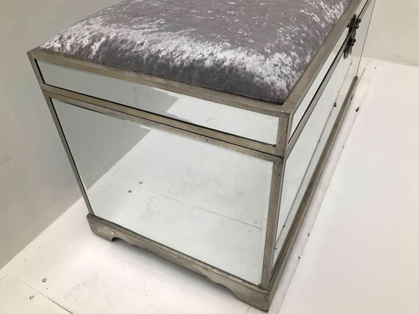Mirrored Storage Trunk with all bevelled mirror panels, the lift up lid is upholstered in a silver crushed velvet material, so can be used as a seat when closed, wood and mirror and cloth, antiqued silver finish.